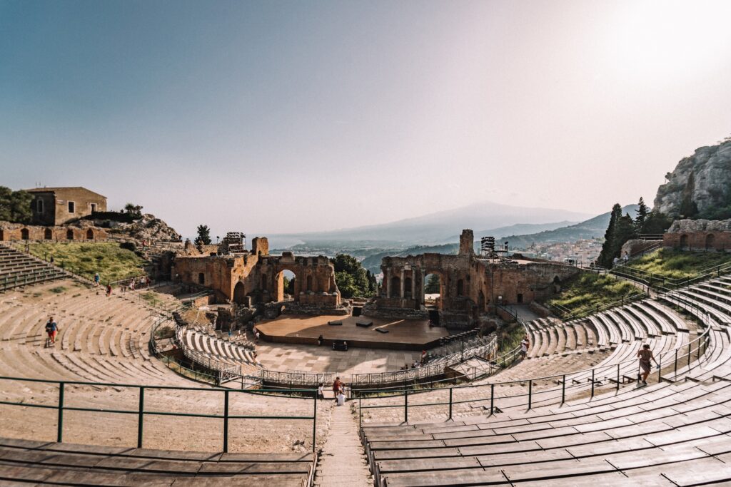 Greek Amphitheatre in Taormina with Mount Etna in the background part of popular guides