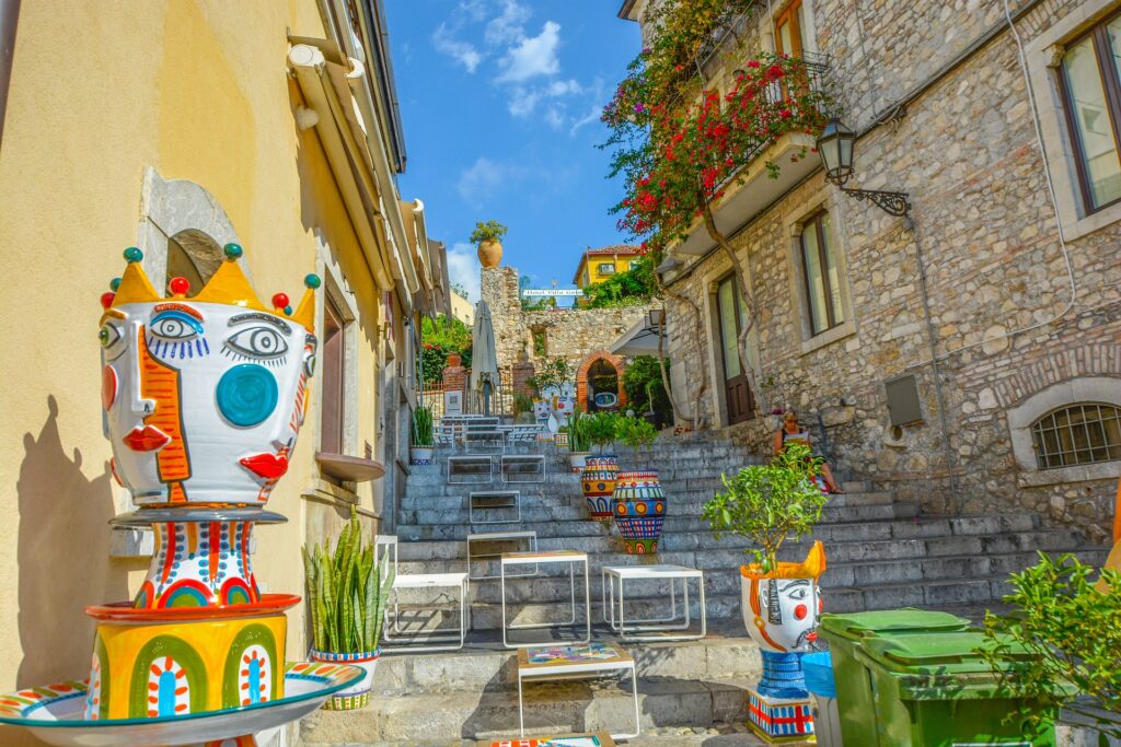 Stairs to Taormina centre with Sicilian sculptures