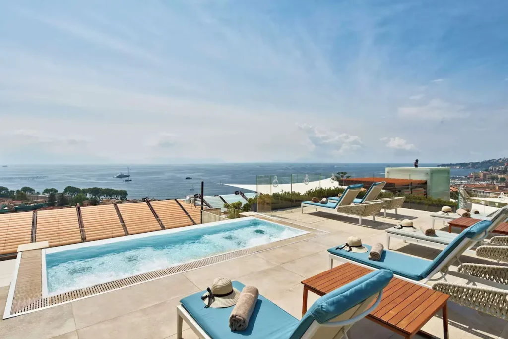 The Britannique Naples terrace with a pool
