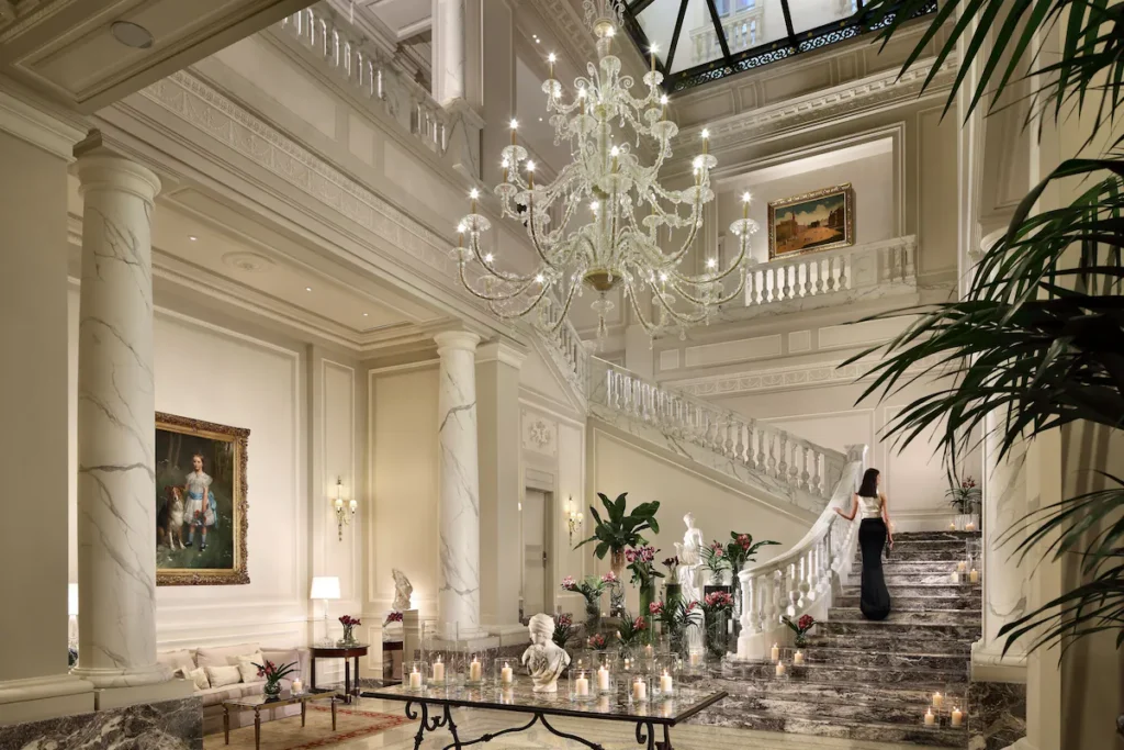 Palzzo Parigi hotel's lobby with a marble staircase